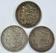 1885, 1891, & 1902 Morgan Silver Dollars. Sharp circs