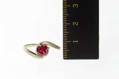 14K White Gold Round Syn. Ruby Solitaire Wavy Bypass Ring