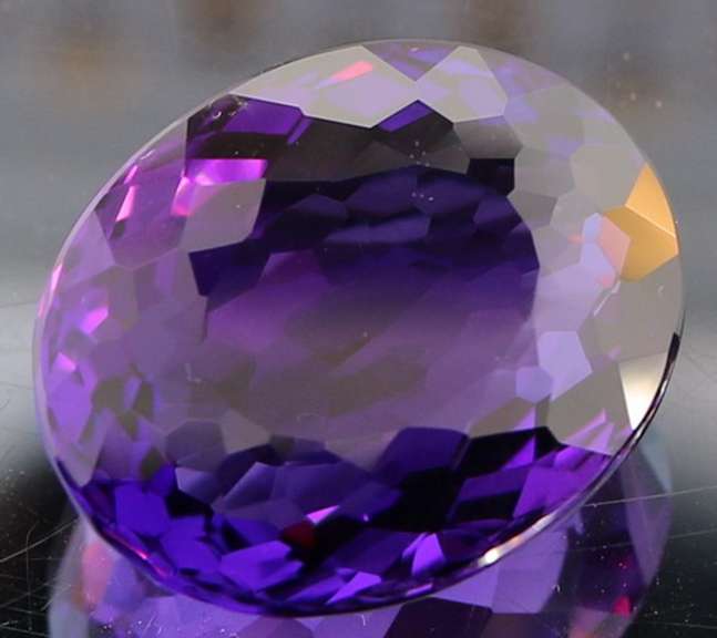 Oval cut 30.58ct royal purple created Amethyst
