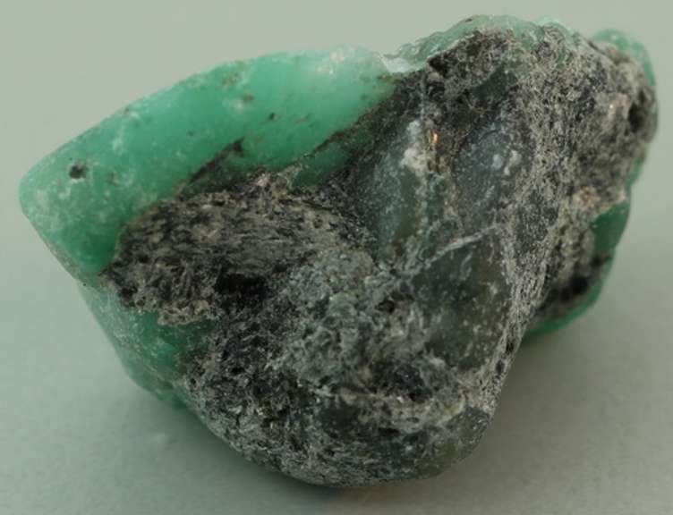 Verdant 26.20ct raw Emerald in matrix