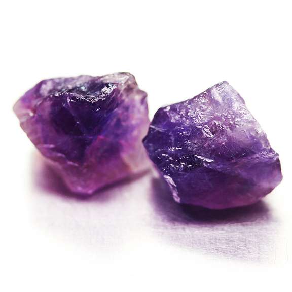 Collectors rich untreated 19.68ct uncut Amethyst pair
