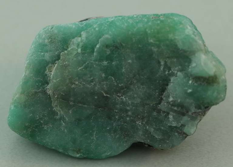 Verdant 26.20ct raw Emerald in matrix