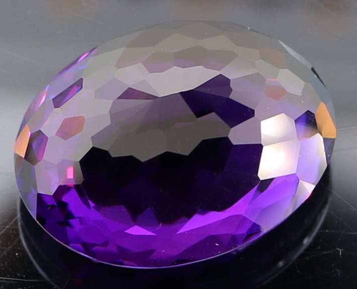 Oval cut 30.58ct royal purple created Amethyst