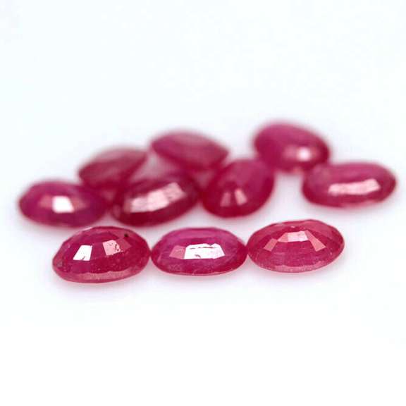 Vibrant 8.07ct oval cut reddish pink Ruby set