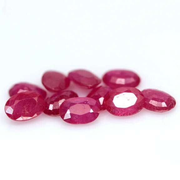 Vibrant 8.07ct oval cut reddish pink Ruby set