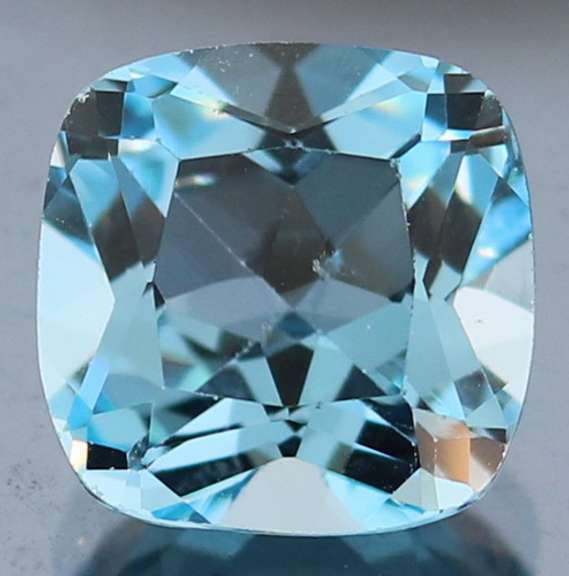 Captivating 9.17ct 12mm high fire cushion cut Topaz