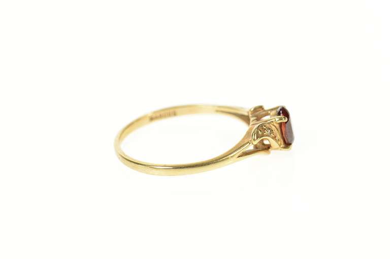 10K Yellow Gold Retro Oval Syn. Garnet CZ Accent Wavy Ring