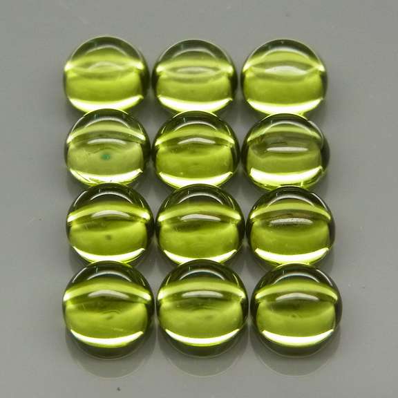 Pristine 8.03ct 12pc lime green Peridot set