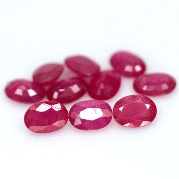 Vibrant 8.07ct oval cut reddish pink Ruby set