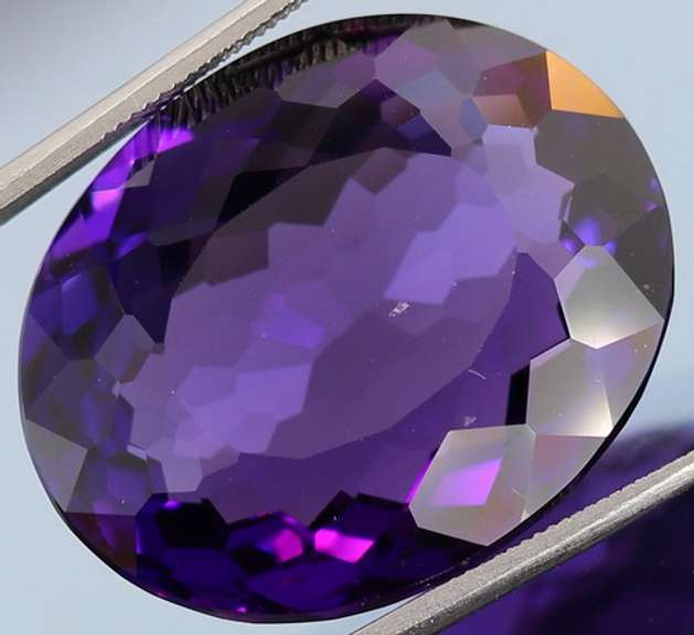 Oval cut 27.4ct royal purple created Amethyst