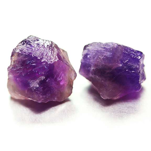 Collectors rich untreated 19.68ct uncut Amethyst pair