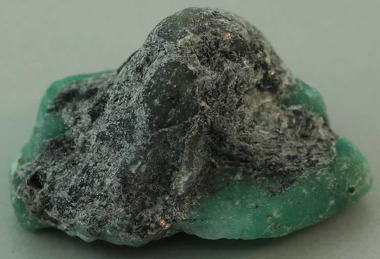 Verdant 26.20ct raw Emerald in matrix