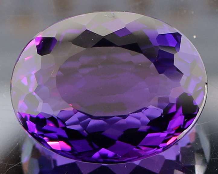 Oval cut 30.58ct royal purple created Amethyst