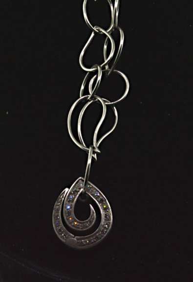 Highlight :  Hand made 18kt White Gold Necklace with Diamond Swirl Pendants