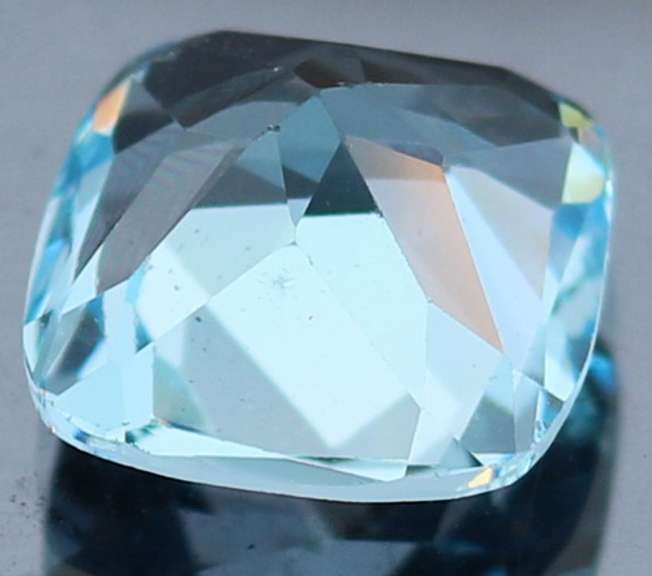 Captivating 9.17ct 12mm high fire cushion cut Topaz