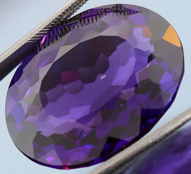 Oval cut 27.4ct royal purple created Amethyst
