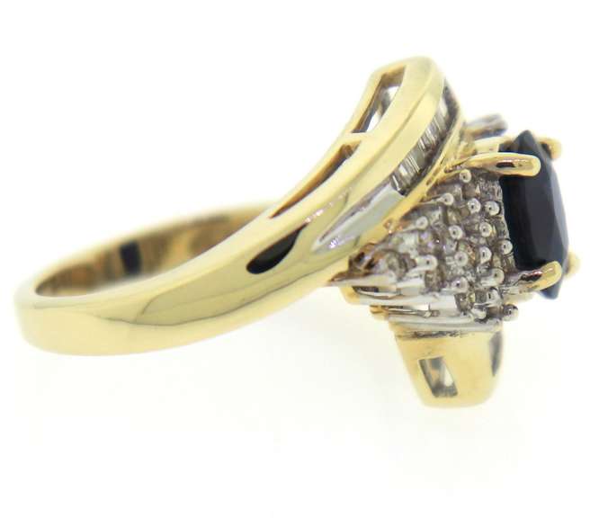 Wonderful Yellow Gold Oval Sapphire and Diamond Baguette Ring