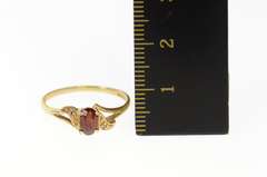 10K Yellow Gold Retro Oval Syn. Garnet CZ Accent Wavy Ring