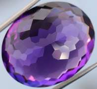 Oval cut 27.4ct royal purple created Amethyst