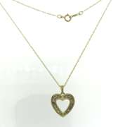 Handsome Yellow Gold Baguette Diamond Heart Pendant on Chain