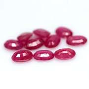 Vibrant 8.07ct oval cut reddish pink Ruby set