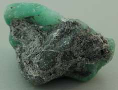 Verdant 26.20ct raw Emerald in matrix