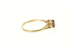 10K Yellow Gold Retro Oval Syn. Garnet CZ Accent Wavy Ring