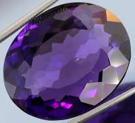 Oval cut 27.4ct royal purple created Amethyst