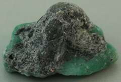 Verdant 26.20ct raw Emerald in matrix