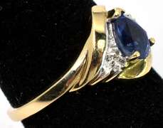 Elegant Pear-Cut Sapphire & Diamond Accent Ring in Yellow Gold