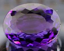 Oval cut 30.58ct royal purple created Amethyst