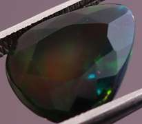 Rainbow flashing 2.84ct Black Opal