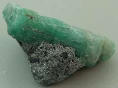 Verdant 26.20ct raw Emerald in matrix