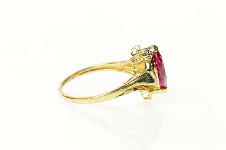 10K Yellow Gold Diamond Accent Marquise Syn. Ruby Bypass Ring