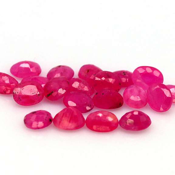 Vibrant 6.65ct oval cut reddish pink Ruby set