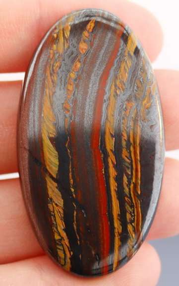 Dramatic 83.96ct Tiger Eye cabochon