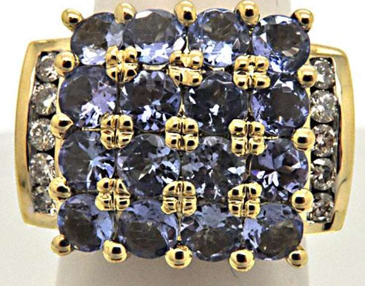 14K YELLOW GOLD TANZANITE AND DIAMOND RING.