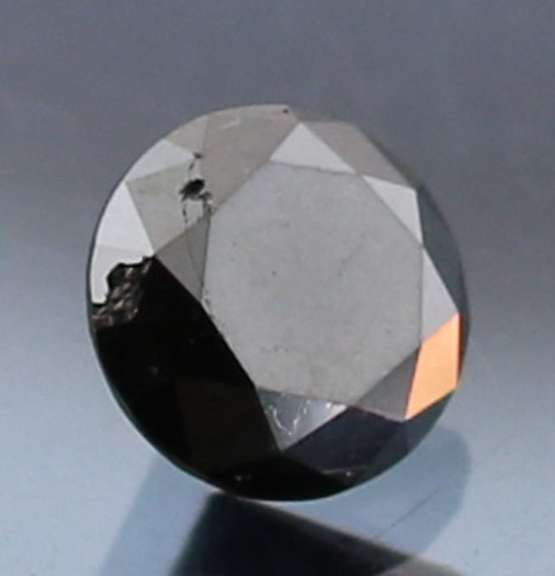 Very fine .93ct smooth cut Black Diamond solitaire
