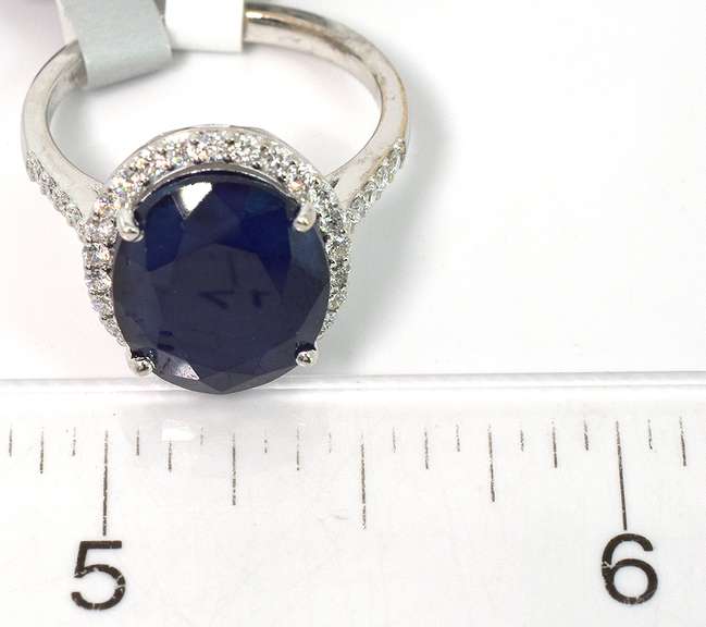 Impressive Sapphire & Diamond Halo Ring in 18KT White Gold
