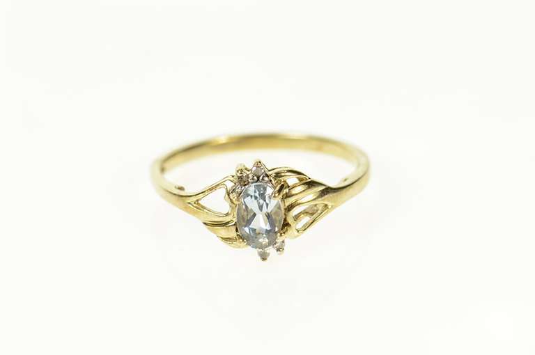 10K Yellow Gold Oval Blue Topaz Diamond Bypass Ring