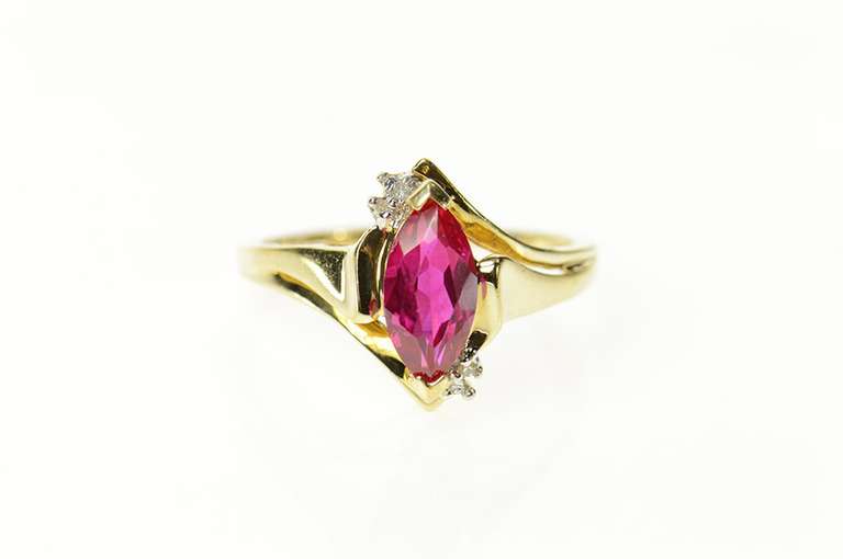 10K Yellow Gold Diamond Accent Marquise Syn. Ruby Bypass Ring