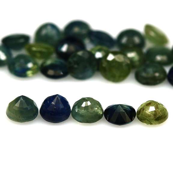 Heated only! 6.51ct blue green Sapphire set