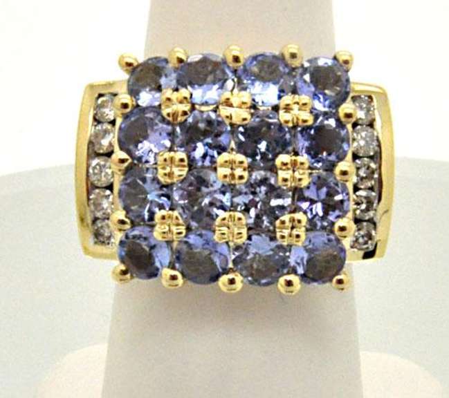 14K YELLOW GOLD TANZANITE AND DIAMOND RING.