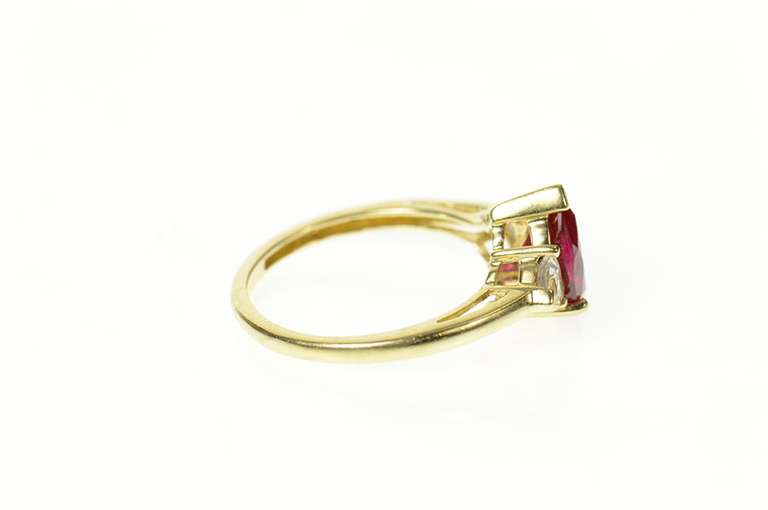 10K Yellow Gold Pear Syn. Garnet CZ Accent Three Stone Ring