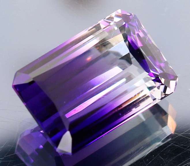 Beautiful 24.87ct top color created Ametrine