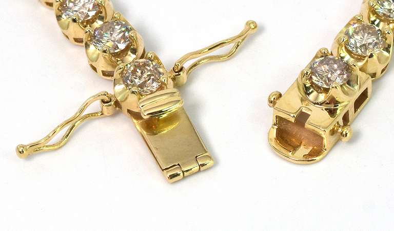 Stunning 7.01CTW Diamond Tennis Bracelet in 14KT Yellow Gold