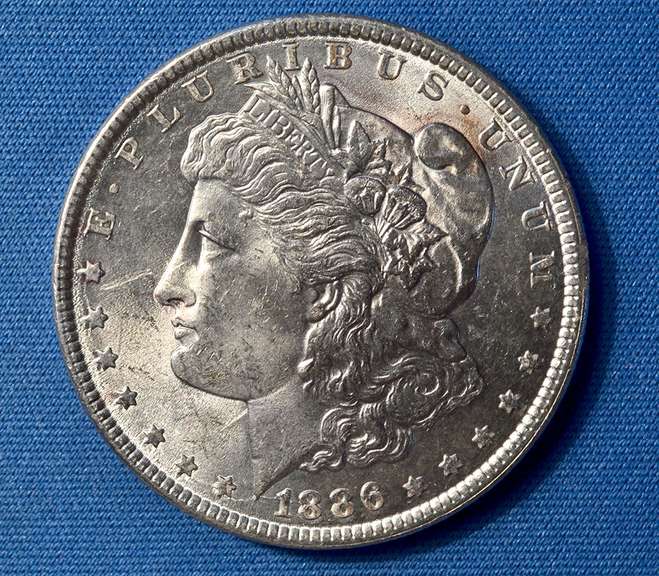 1886 B U MORGAN DOLLAR