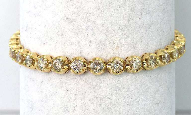Stunning 7.01CTW Diamond Tennis Bracelet in 14KT Yellow Gold