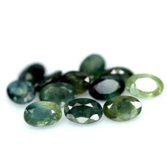 Multi-hue 6.75ct natural blue green Sapphire set