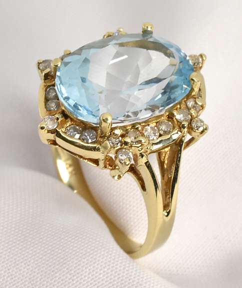Intriqueing Blue Topaz and Diamond Ring